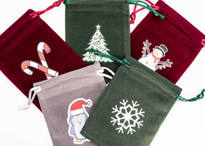 Christmystery mystery Christmas themed dungeons and dragons (aka dnd or d&d) game dice set, including a d20, d12, d10, d8, d6, and d4 and velvet bag