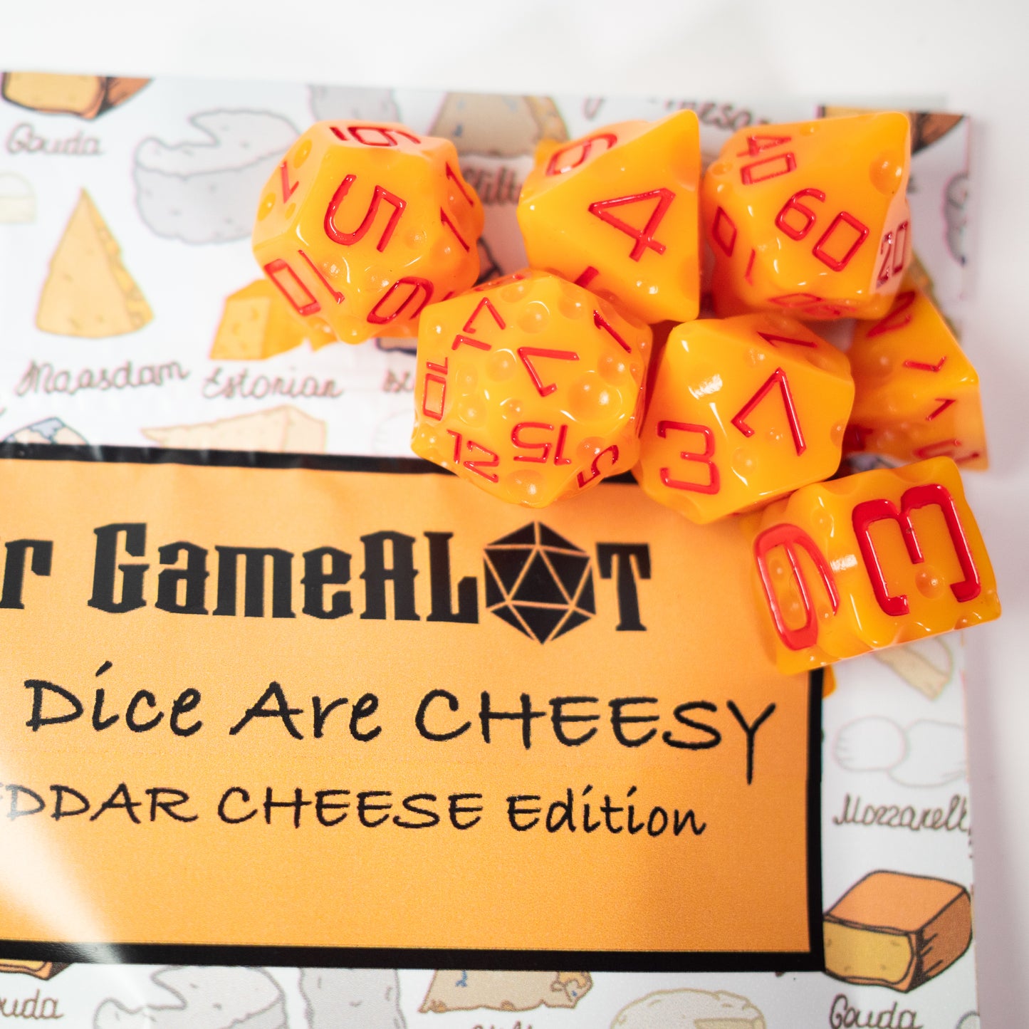 these dice are cheesy fun themed resin cheddar dungeons and dragons (aka dnd or d&d) game dice set, including a d20, d12, d10, d8, d6, and d4