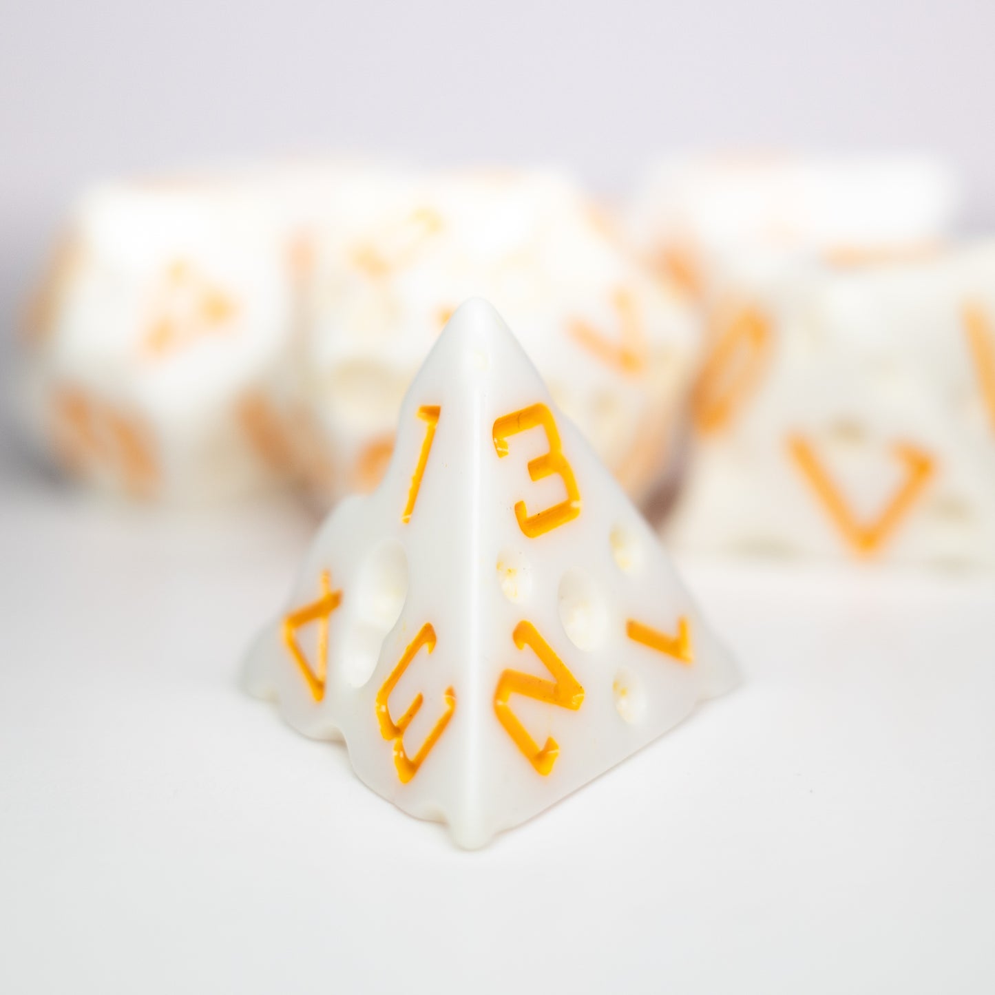 these dice are cheesy fun themed resin mozzarella dungeons and dragons (aka dnd or d&d) game dice set, including a d20, d12, d10, d8, d6, and d4