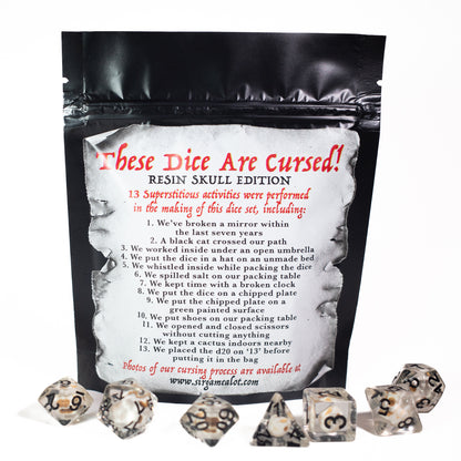 cursed resin skull design dungeons and dragons (aka dnd or d&d) game dice set, including a d20, d12, d10, d8, d6, and d4