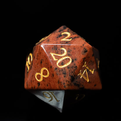 mahogany obsidian glass gemstone dungeons and dragons (aka dnd or d&d) d20 game die or dice with gold numbers on a black background