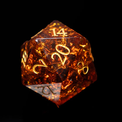 amber-colored glass gemstone dungeons and dragons (aka dnd or d&d) d20 game dice or die with gold numbers on a black background