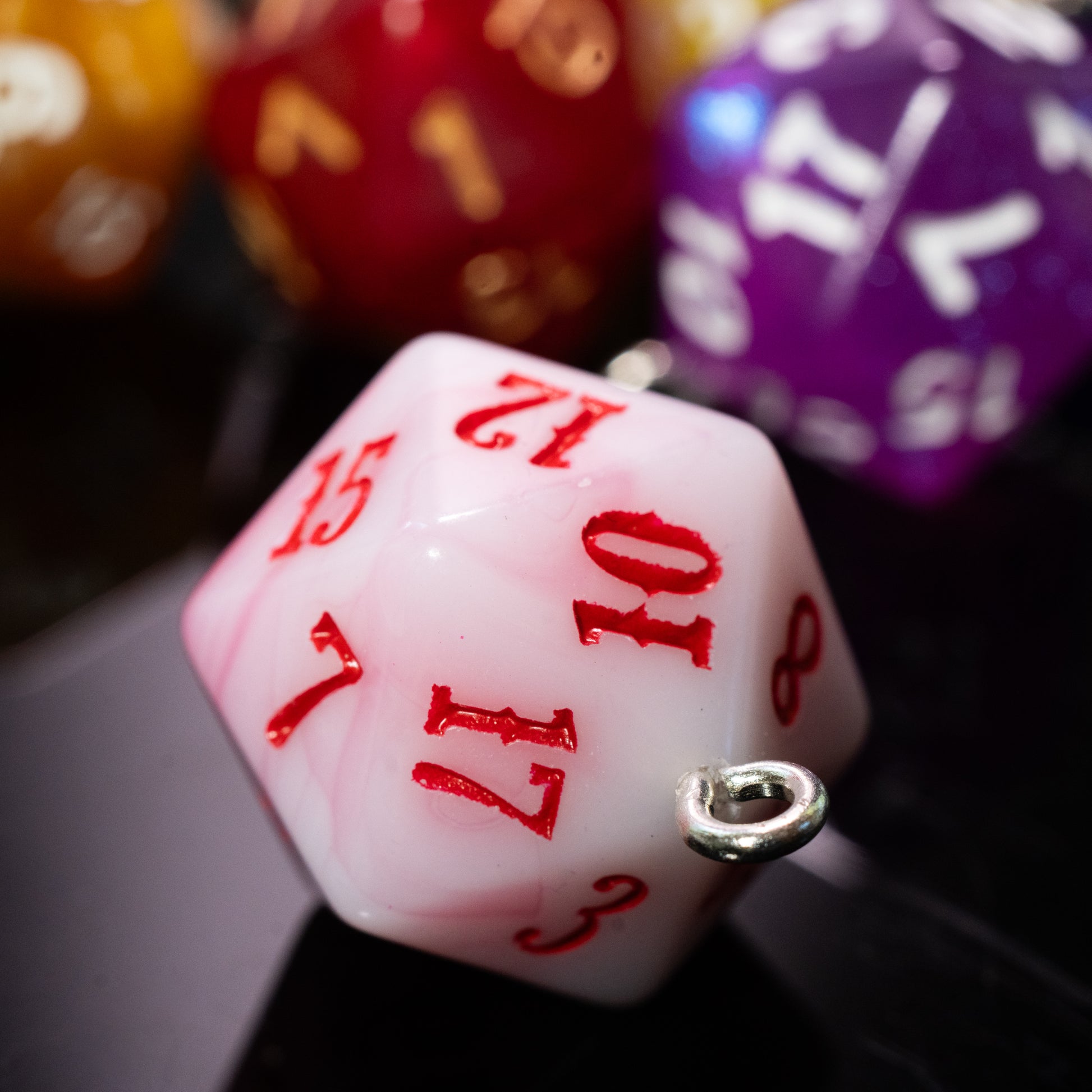 set of dungeons and dragons (aka dnd or d&d) d20 twenty sided game dice, converted into hanging ornaments or keychains