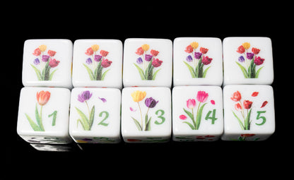 Set of d6 six sided dice with tulip floral designs on a black background for Yahtzee and other dice games