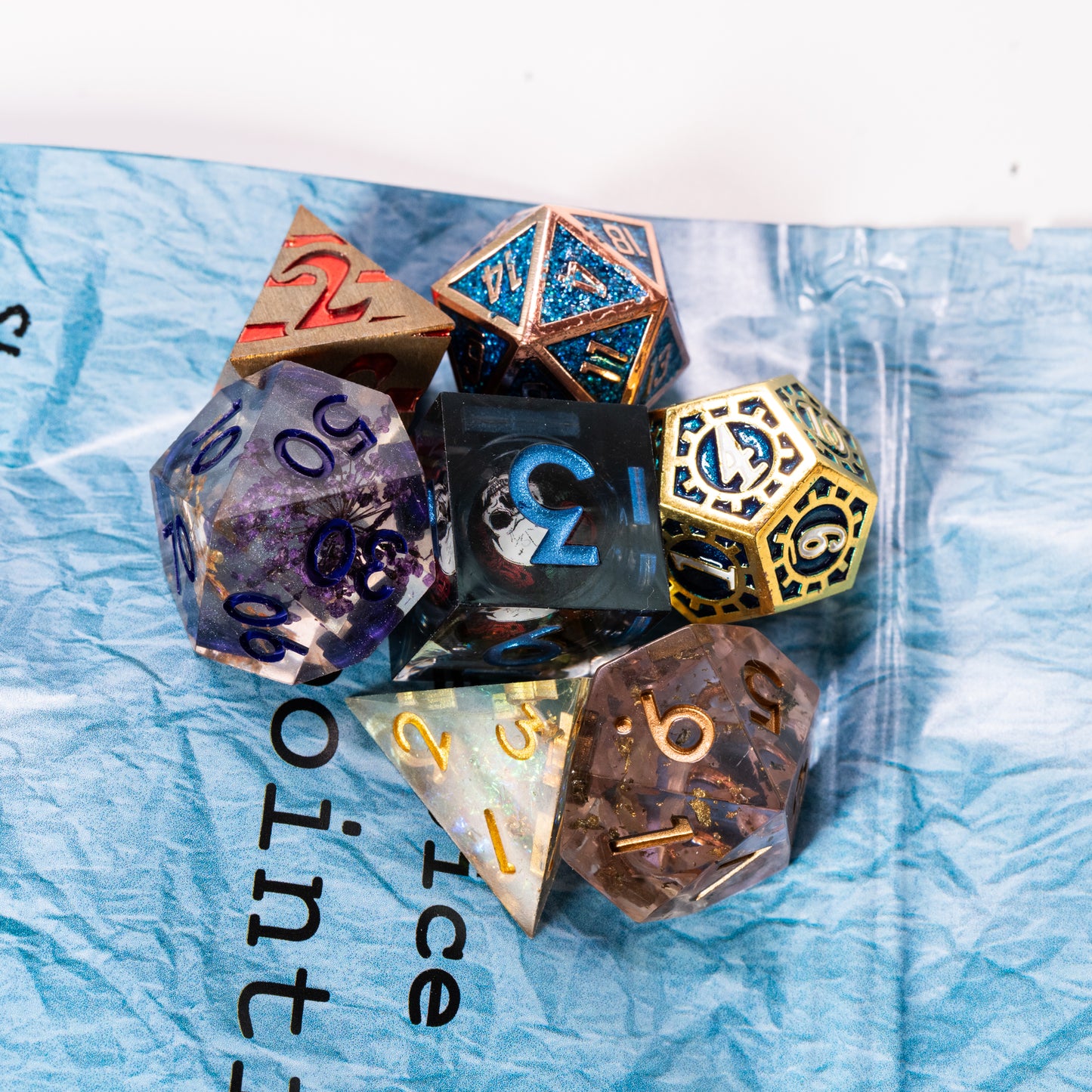 disappointing resin and metal dungeons and dragons (aka dnd or d&d) game dice set, including a d20, d12, d10, d8, d6, and d4
