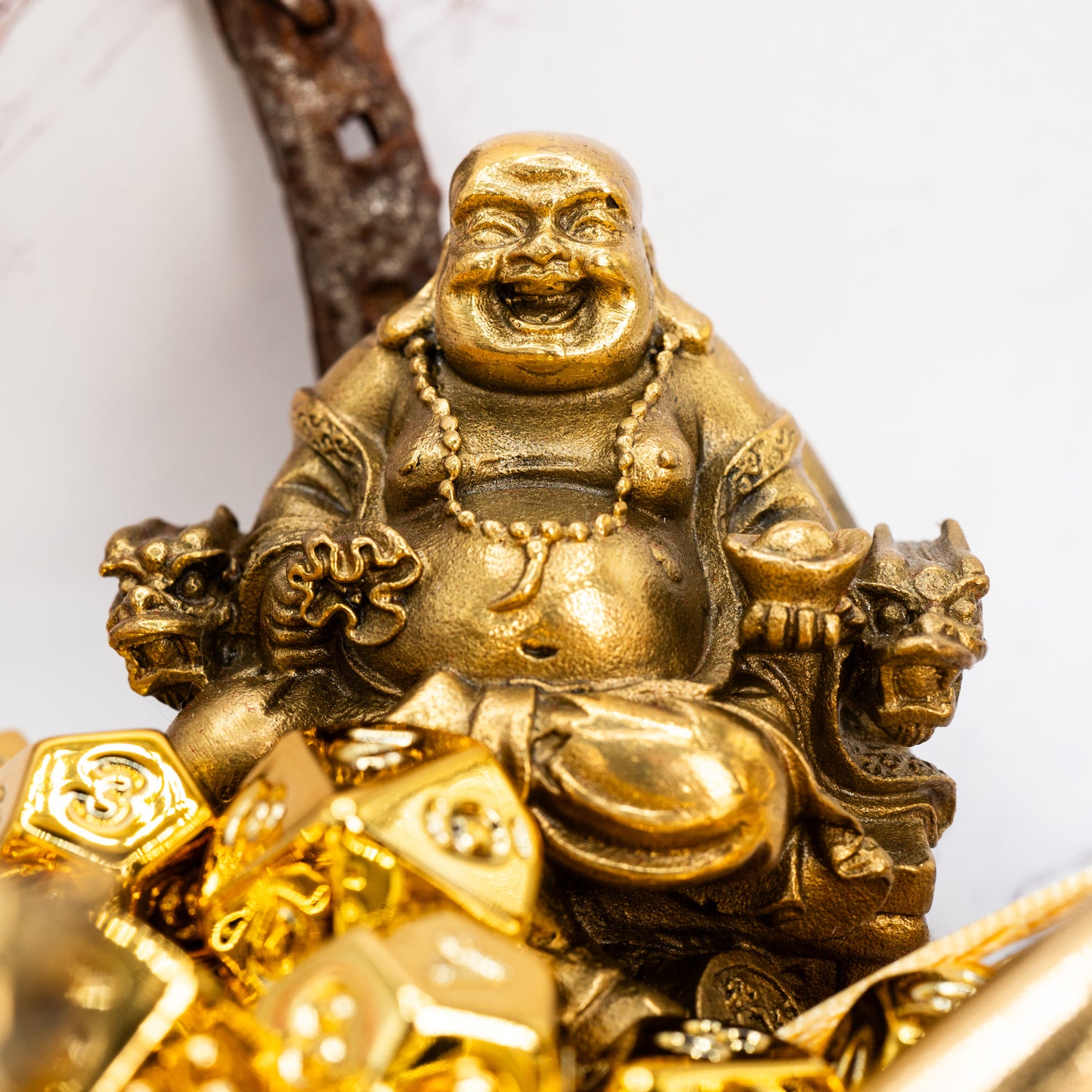 Gold Buddha figurine with lucky golden dungeons and dragons (aka dnd or d&d) game dice set