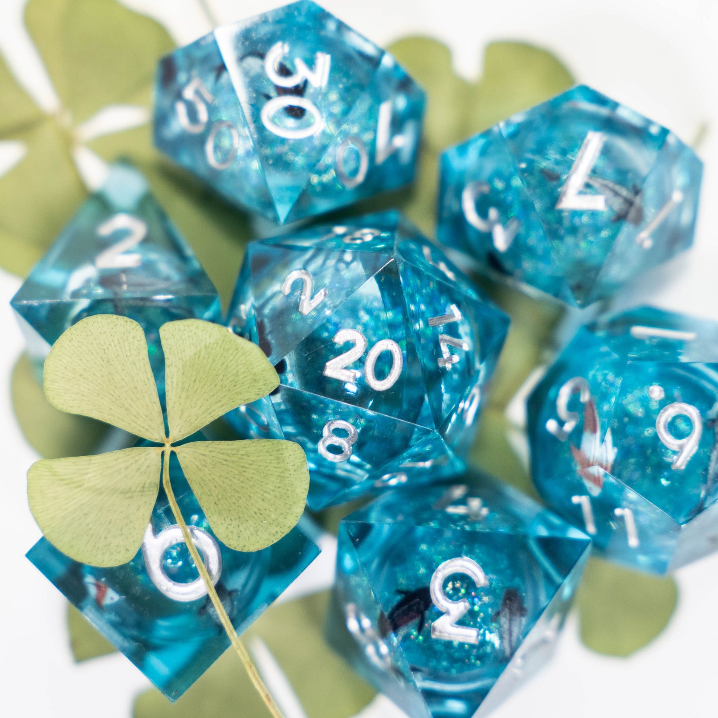 these dice are lucky sharp edge resin koi fish dungeons and dragons (aka dnd or d&d) game dice set, including a d20, d12, d10, d8, d6, and d4