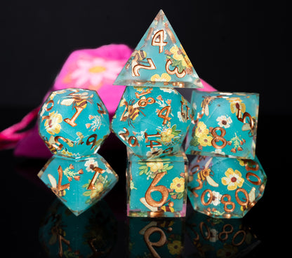 mystery sharp edge resin flowers and butterflies dungeons and dragons (aka dnd or d&d) game dice set, including a d20, d12, d10, d8, d6, and d4
