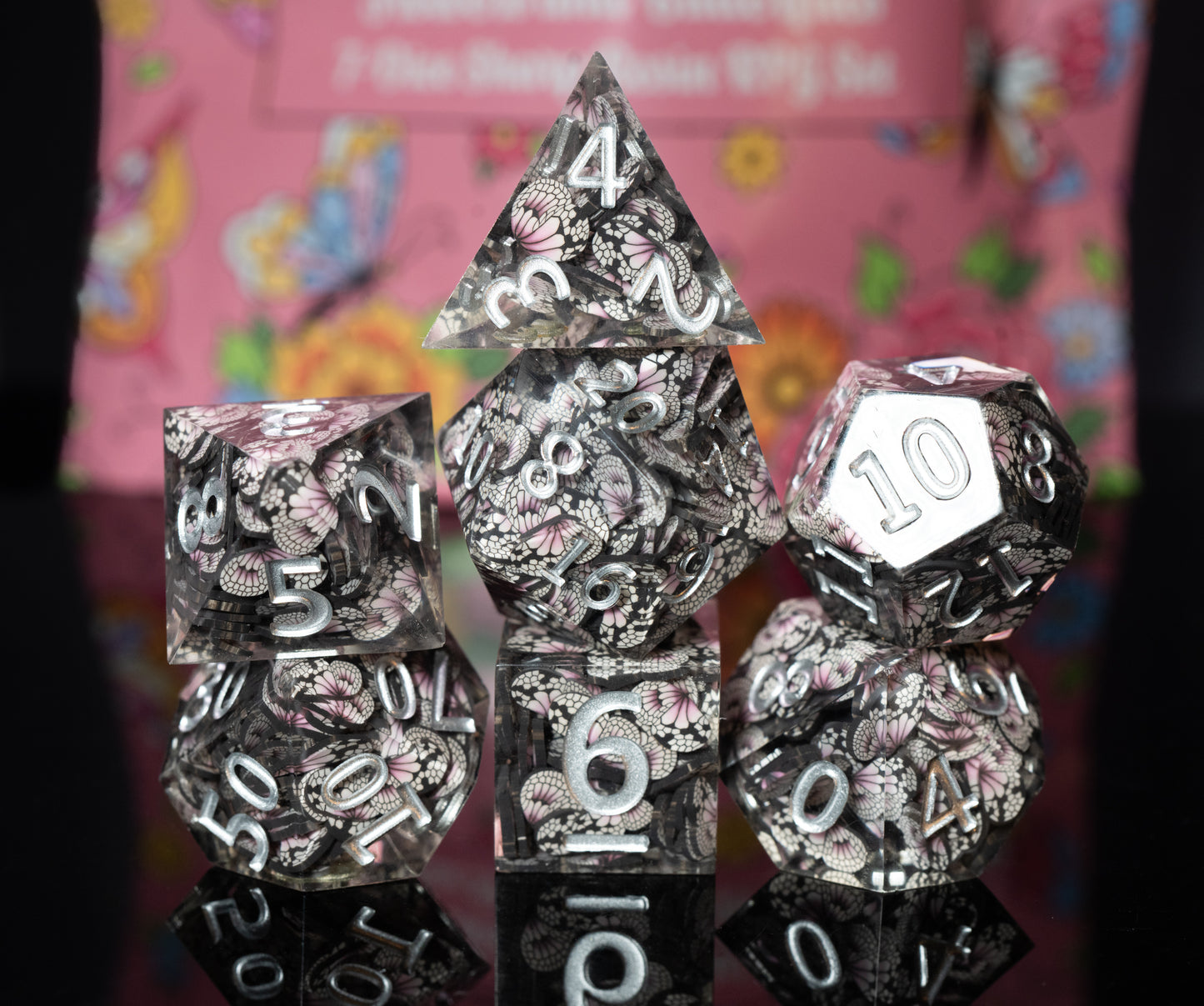 mystery sharp edge resin flowers and butterflies dungeons and dragons (aka dnd or d&d) game dice set, including a d20, d12, d10, d8, d6, and d4