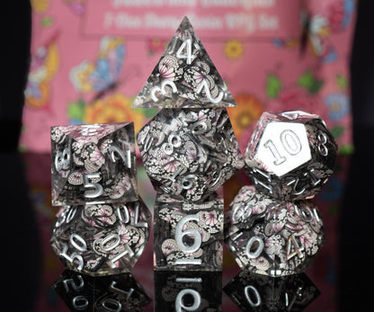 mystery sharp edge resin flowers and butterflies dungeons and dragons (aka dnd or d&d) game dice set, including a d20, d12, d10, d8, d6, and d4