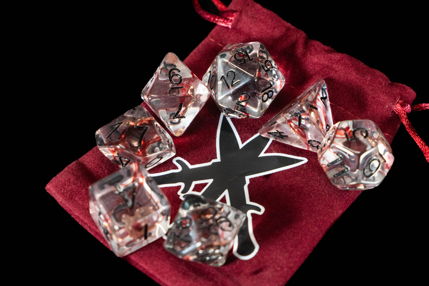 Rogue DND Dice Set – 7 Piece Red Resin Polyhedral RPG Dice with Embedded Throwing Knife Designs & Rogue Velvet Dice Bag | Fantasy TTRPG Dice for Pathfinder, Assassins, Thieves & Stealth Characters